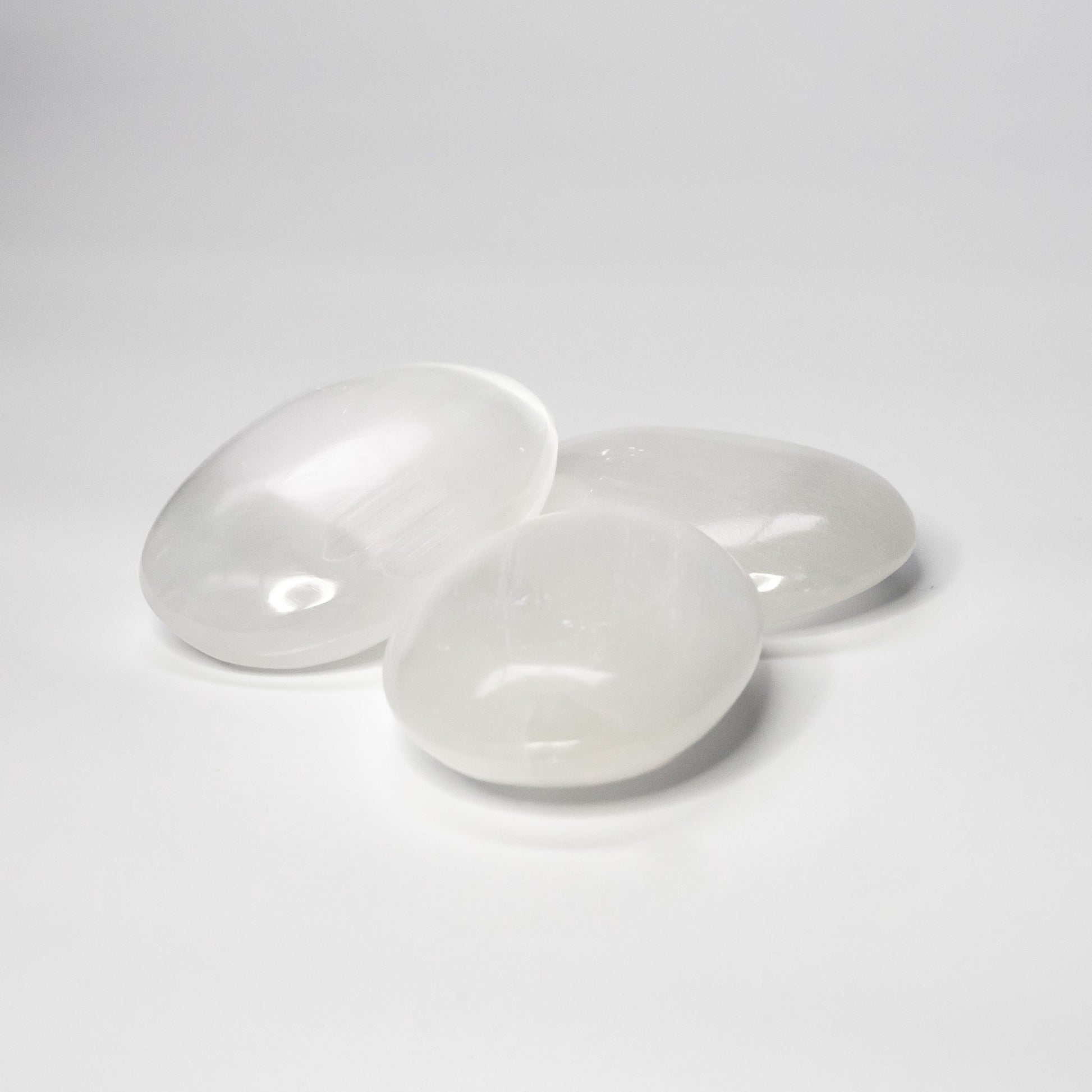 Selenite palm stones white